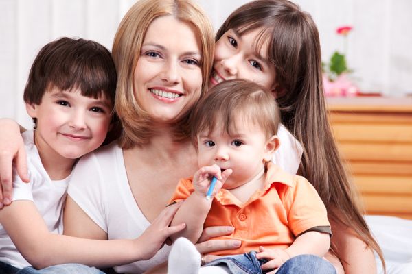 a woman with three children | Source: Shutterstock